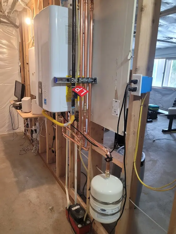Licensed plumber repairing a kitchen sink in Severn
